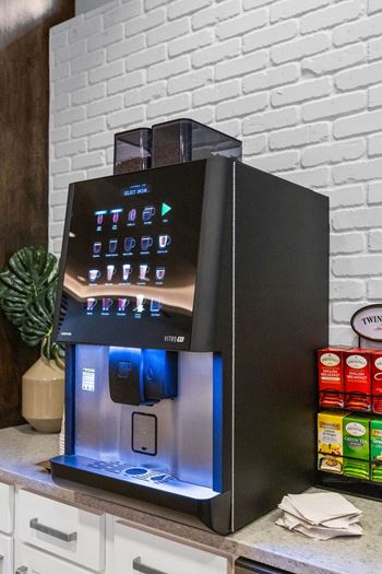A coffee machine sitting on top of a kitchen counter